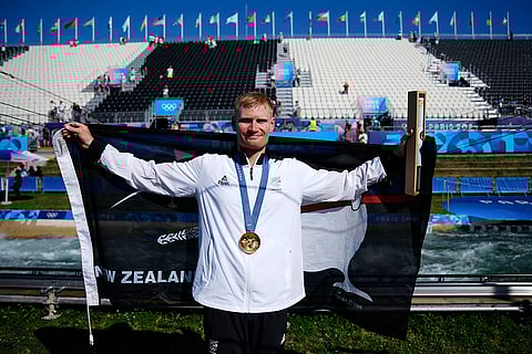 Men's slalom kayak cross medal ceremony: Gold medalist Finn Butcher of New Zealand